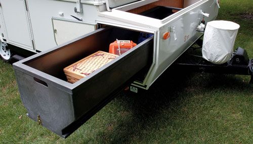 Extendable storage compartment from the van's trunk.