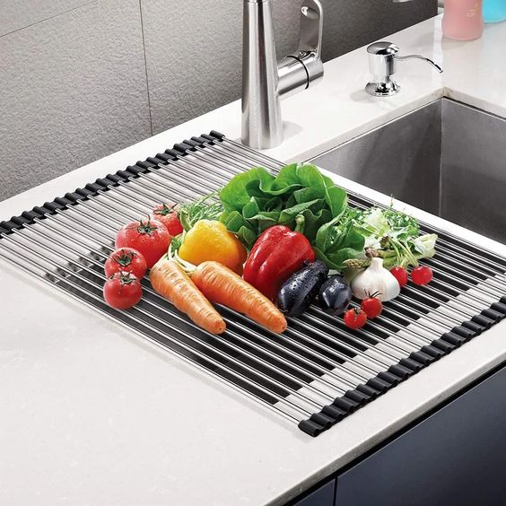 Roll-up dish racks over the sink.