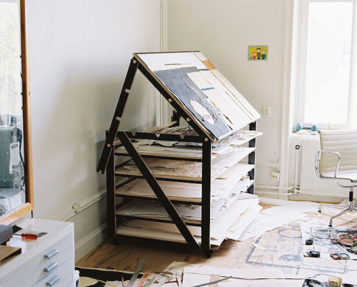 Multifunctional painting table with multiple storage compartments.