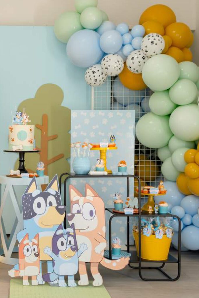 A beautiful spread against a pastel birthday decor with dog family cutouts.