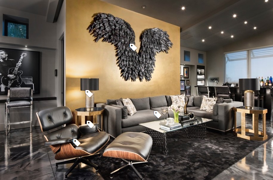 A big black living room with a big black wings mural.