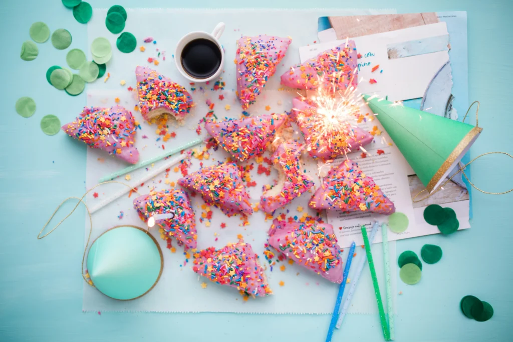 Barbie themed cake slices and decor with a lot of sprinkles.