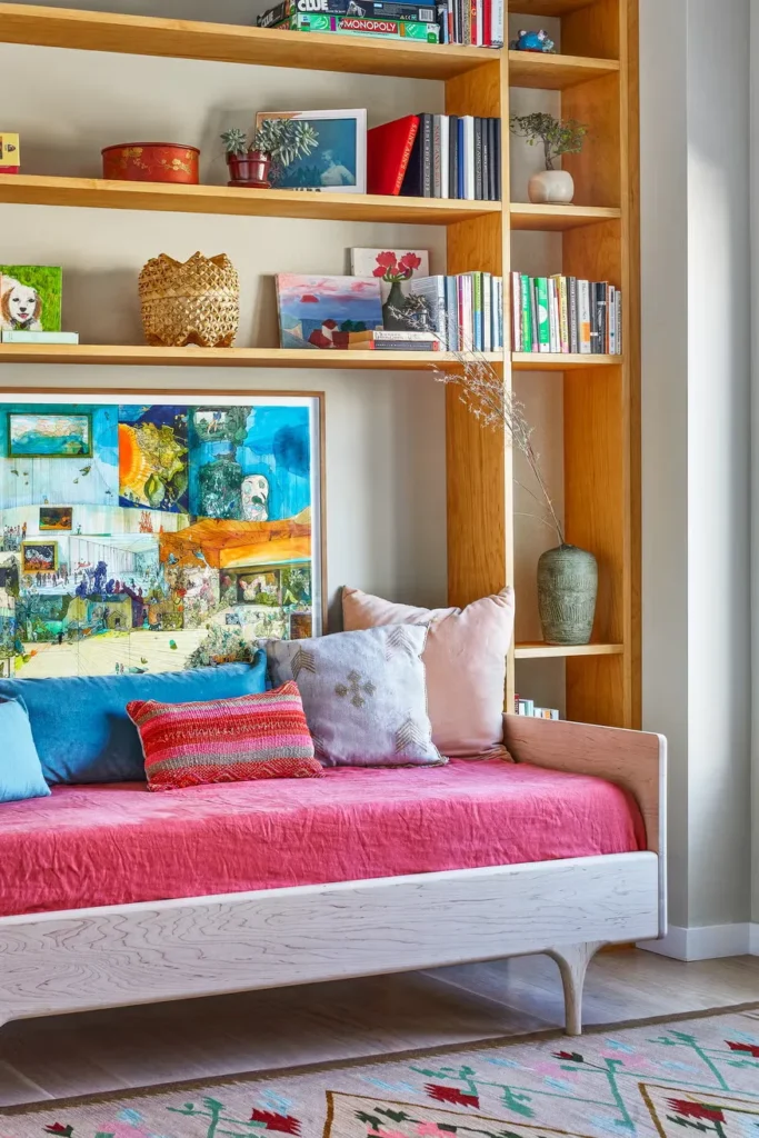 A girl's corner with beautiful organization of books with ornaments.