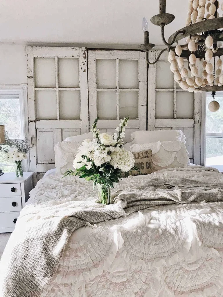 Ruffled bedsheet with a rustic back wall.