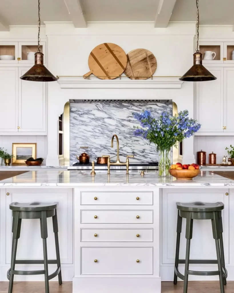 Gold accents against white and marble backdrop.