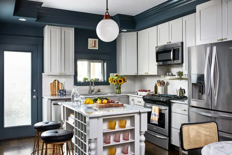 Teal or dark blue color accents against white cabinets.