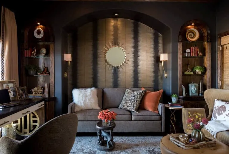 Dark toned and decorated home office and guestroom combo.