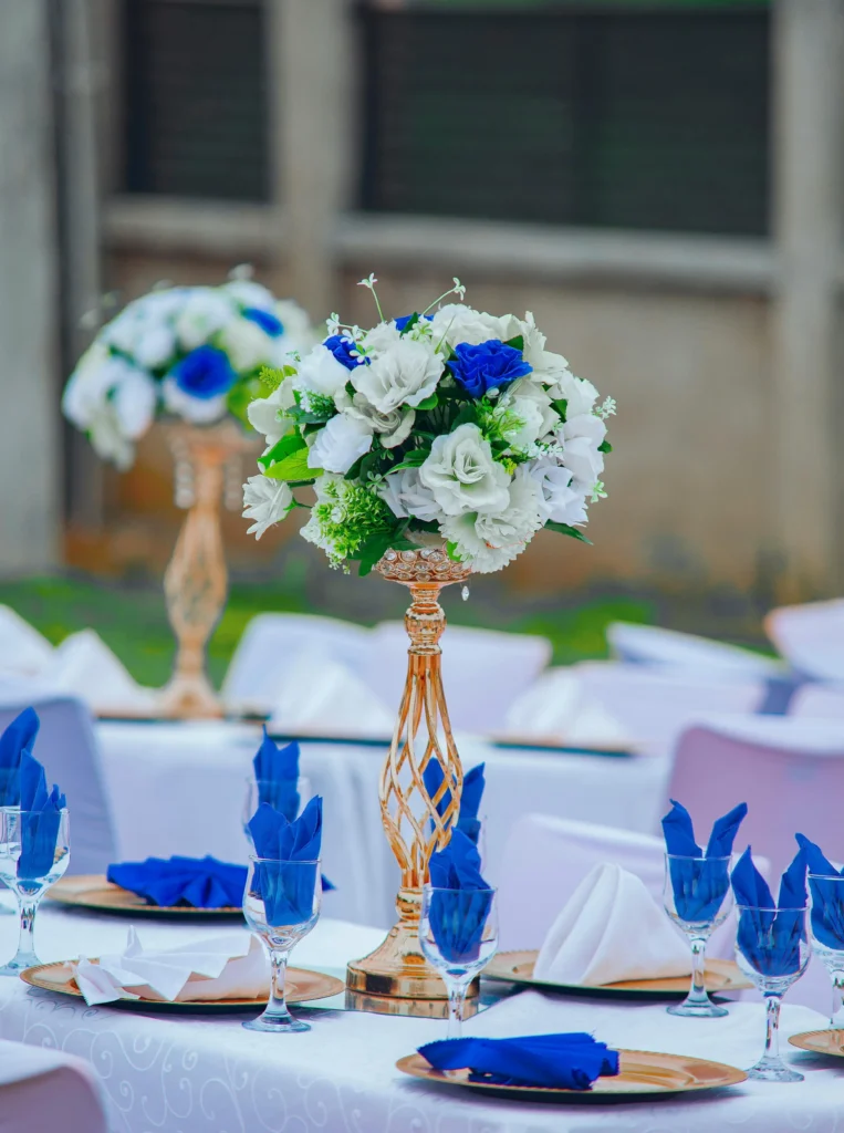 Tall, beamin centerpiece comprising of blue and white flora.